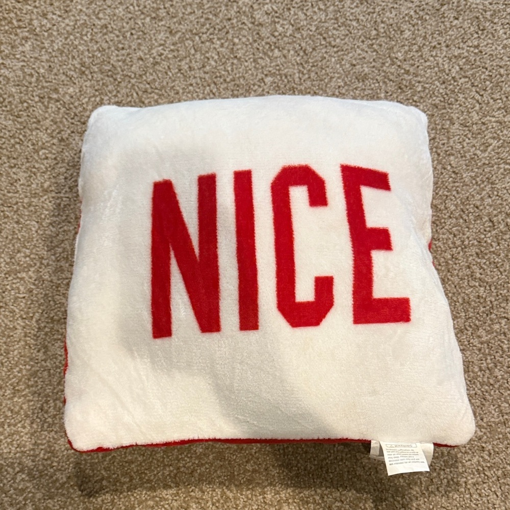 Festive White Pillow with Red 'NICE' and ‘NAUGHTY’ Design